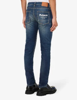 Alexander McQueen Graffiti Brand-embroidered Tapered-leg Regular-fit Stretch-denim Jeans -Fit & Flow Clothing Sales Store R04153535 BLUEWASHED ALT03